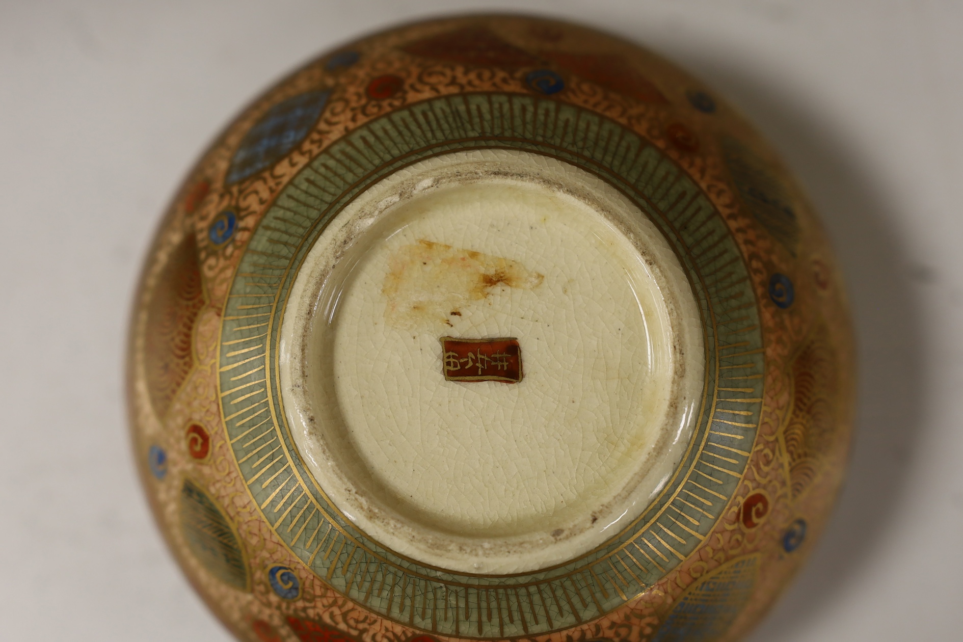 A late 19th century Japanese Satsuma ‘hundred antiques’ gosu blue pot pourri vase and three later items of Satsuma, including a bowl and cover a bowl on stand, a box and cover, tallest 18.5cm high. Condition - vase cover